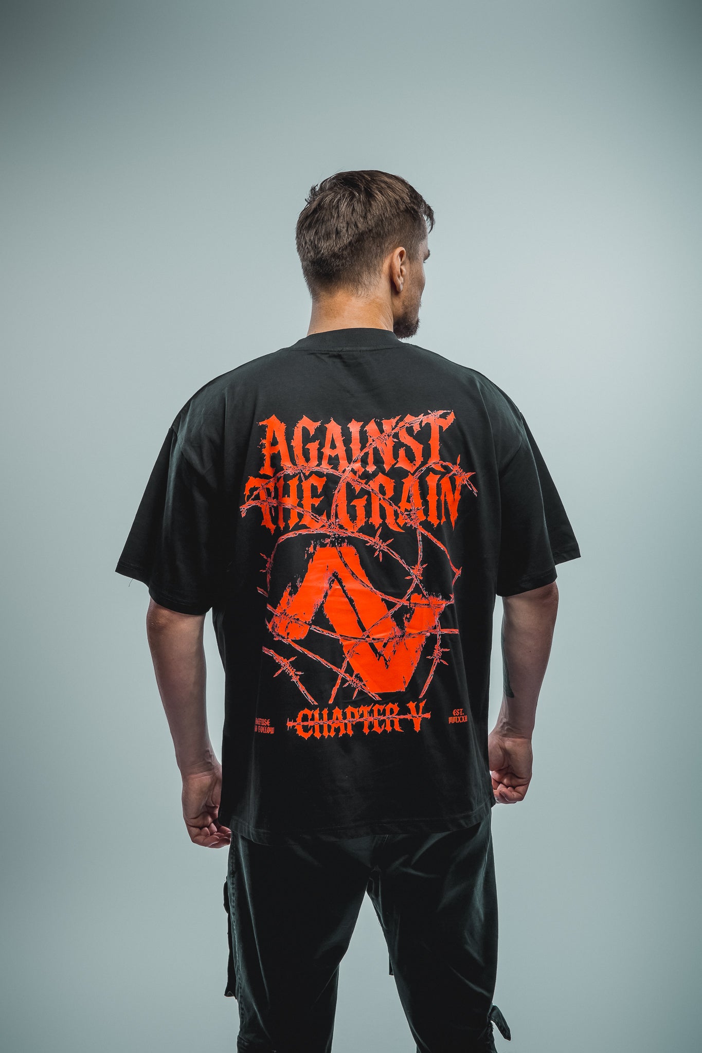 Chapter V 'AGAINST THE GRAIN' Tee